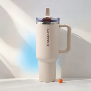 stanley 40oz daily insulated tumbler comes with reusable straw, leak resistant, sturdy handle, versatile for indoor outdoor, cream white