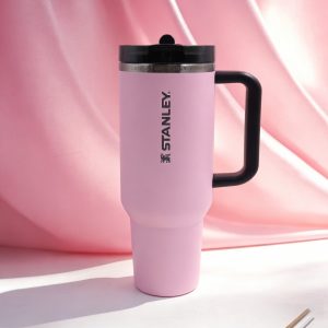 stanley insulated tumbler with handle 40oz stainless steel, leak proof flowstate lid, keeps drinks cold & hot, light pink black logo