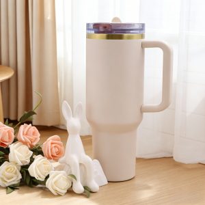 40oz stainless steel tumbler, quartz white & gold rim with pink logo, vacuum insulation technology for temperature control